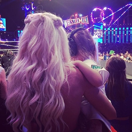 Kaia with her mommy on her father's match.